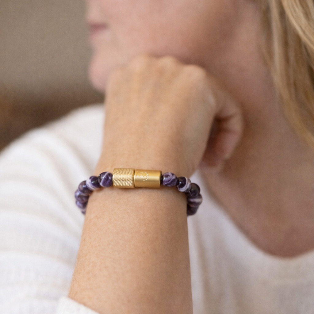 Diane Friedman wearing the Amethyst Enusia Embracelet waterproof pill holder bracelet designed for discreet everyday medication carry