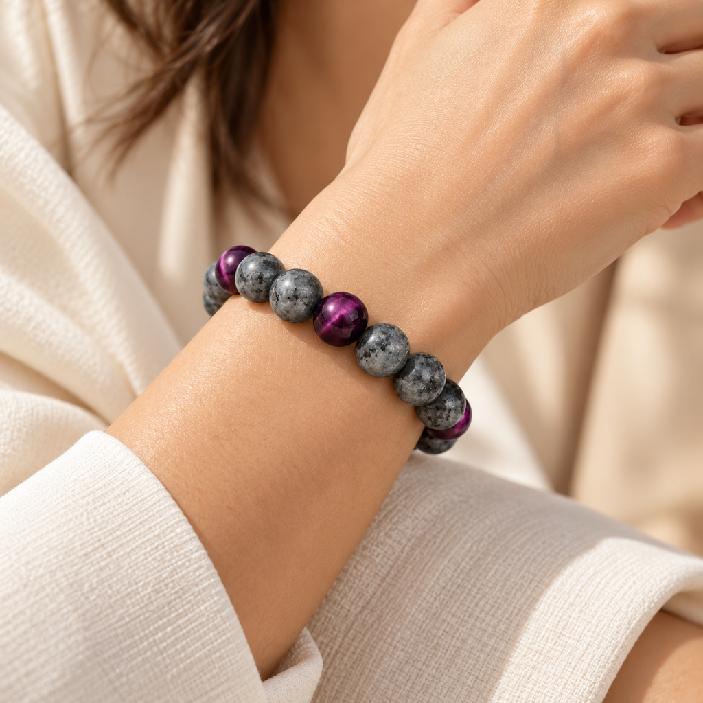 on a woman's wrist Matte gray Labradorite and purple Tiger’s Eye Embracelet™ with a discreet silver pill holder, displayed 