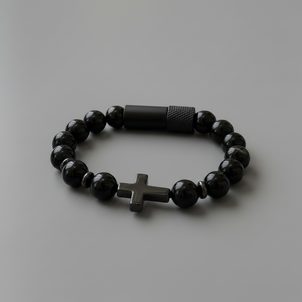 Black beaded bracelet with a cross charm on a white background