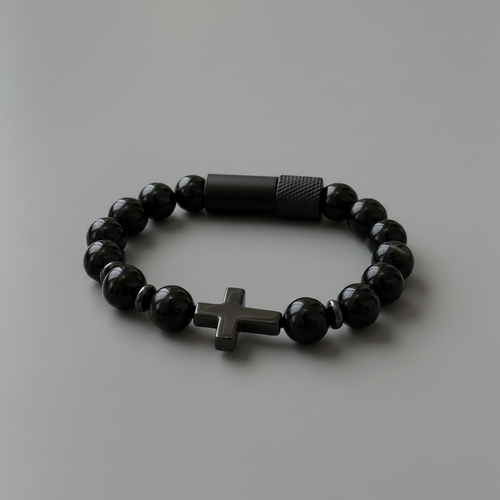 Black beaded bracelet with a cross charm on a white background