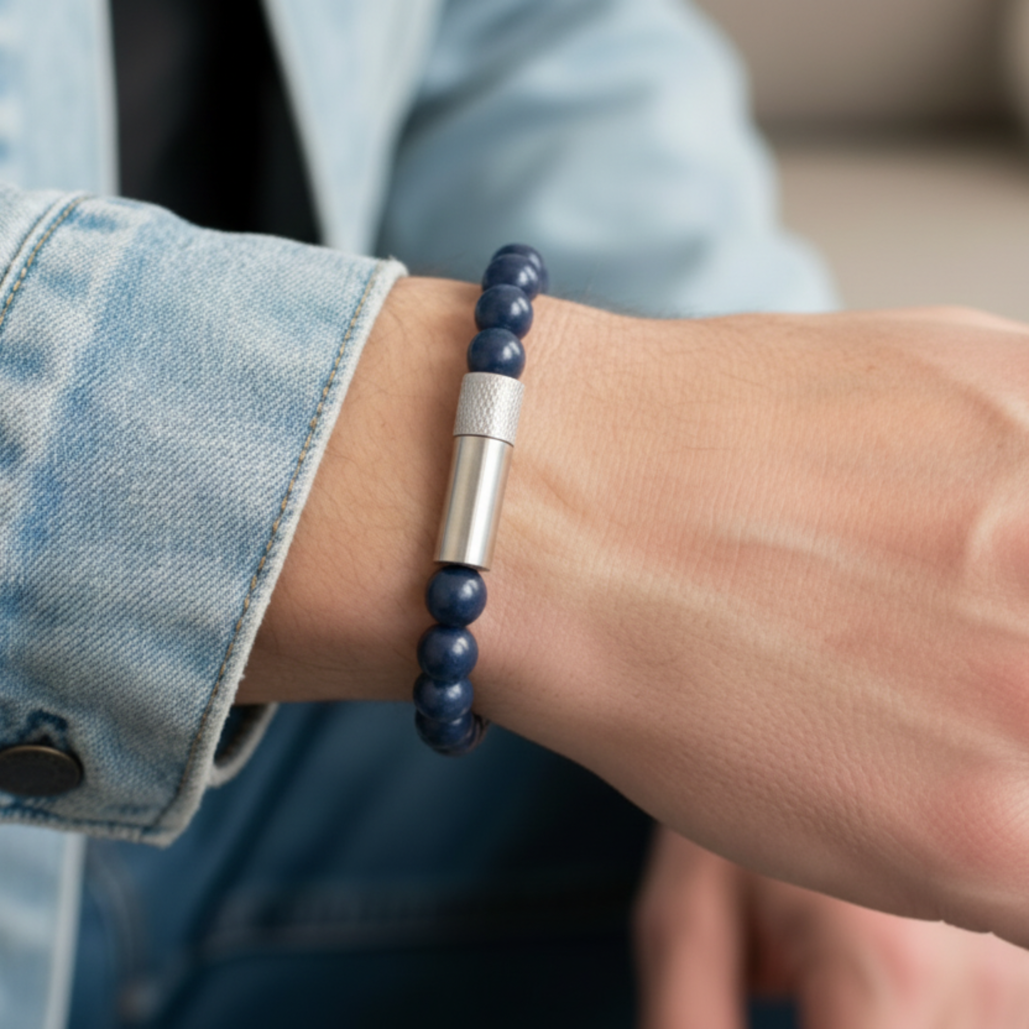 Person wearing a blue beaded bracelet on a casual setting