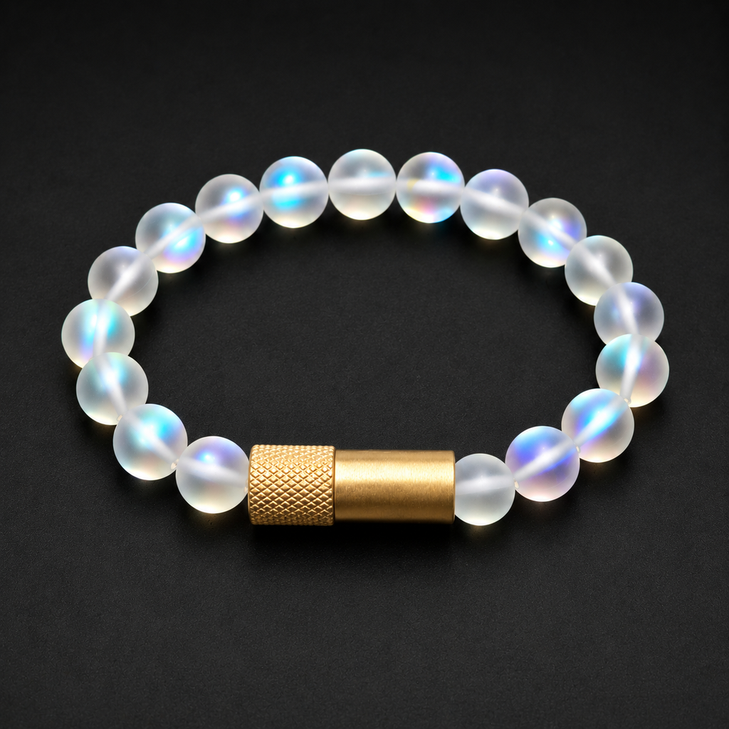 A beaded bracelet with translucent iridescent white beads and a textured gold cylindrical clasp, displayed on a dark black background.